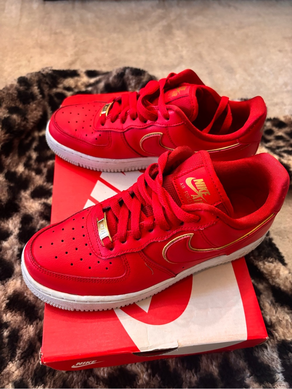 Nike Red Low-Top Sneakers with Gold Accents